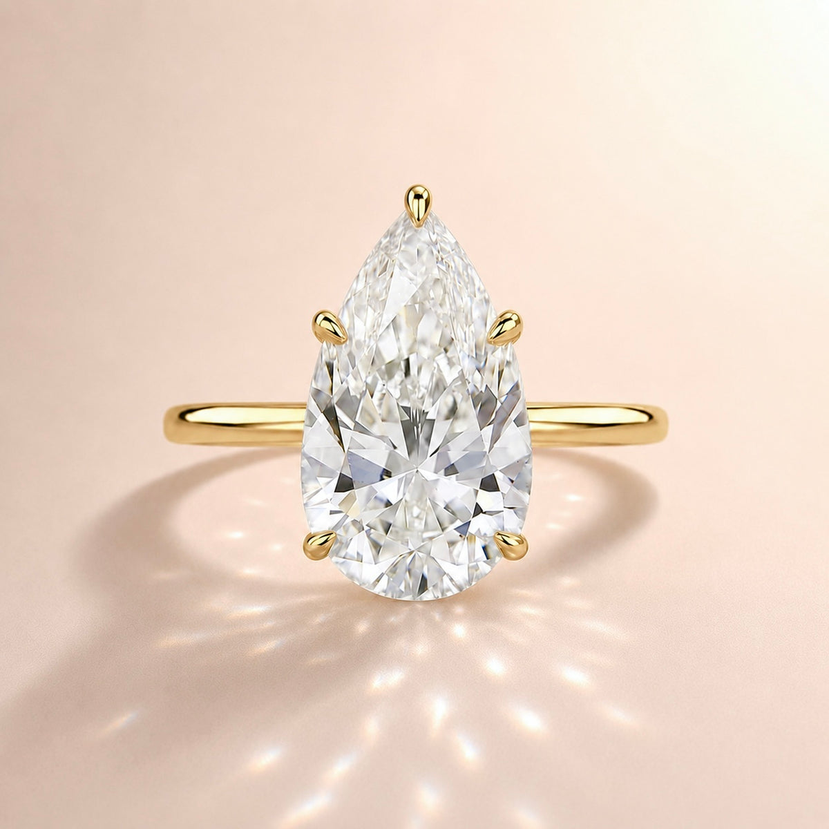 THE 14KT PEAR RING